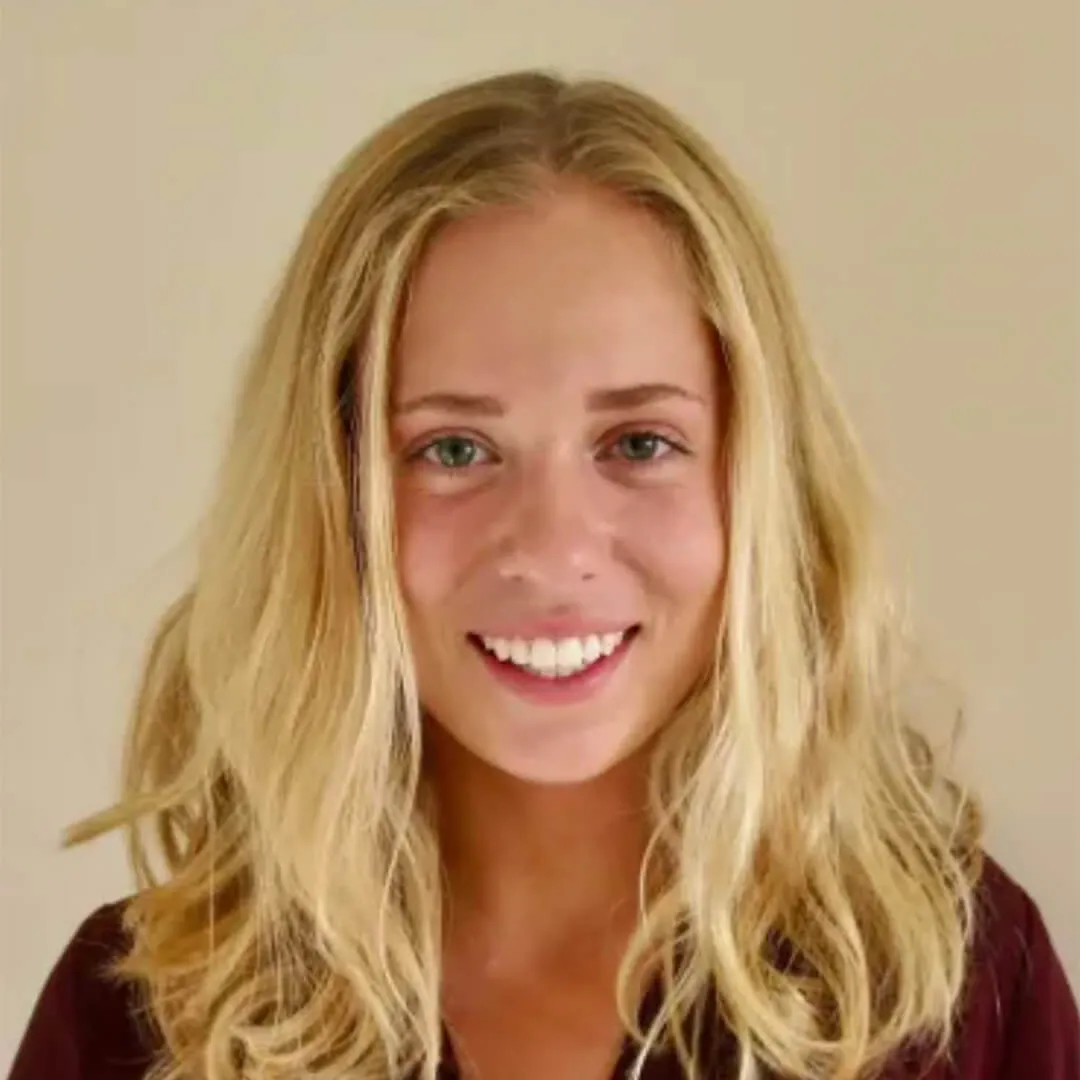 Smiling person facing the camera.