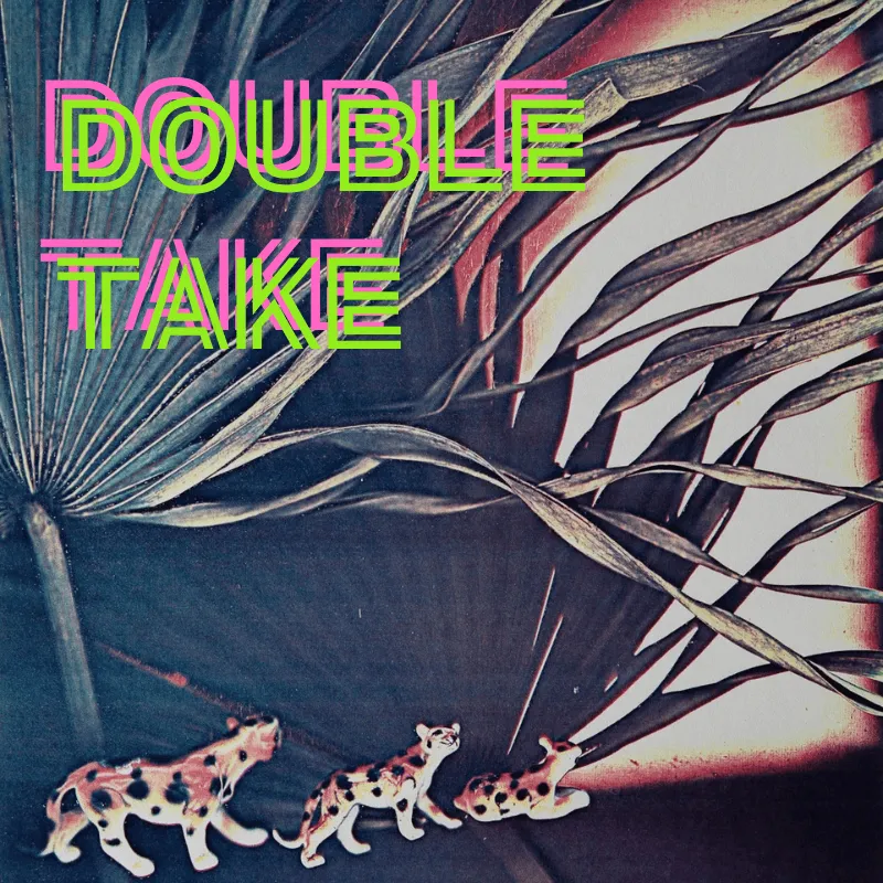 Three toy leopard figurines against a palm leaf backdrop. Text reads "Double Take"
