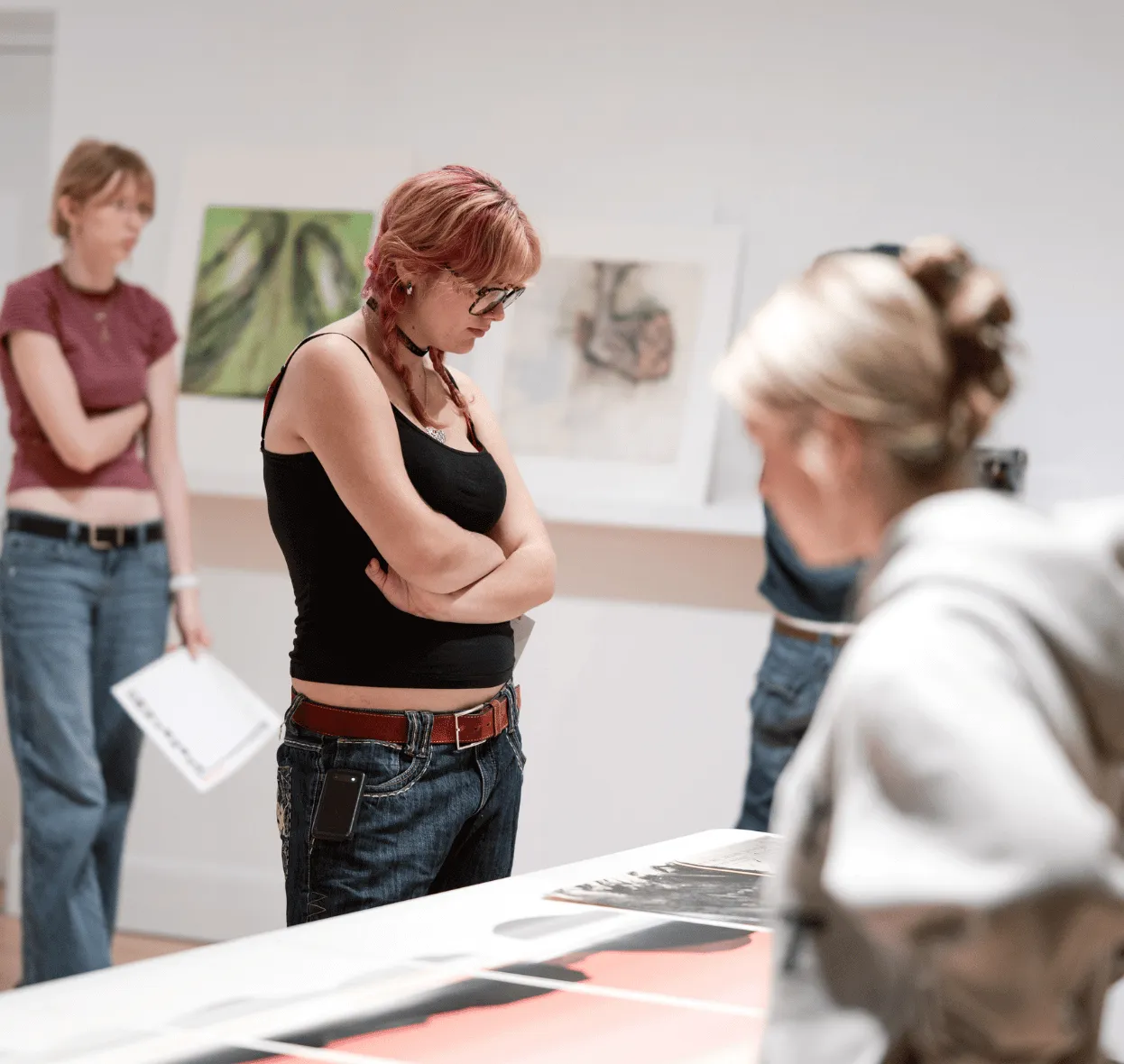 A couple of students viewing works from the collections in the Learning Studio.