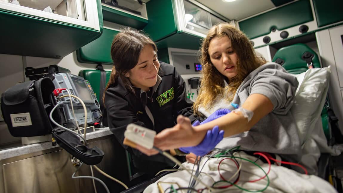Rescue worker and patient in an ambulance.