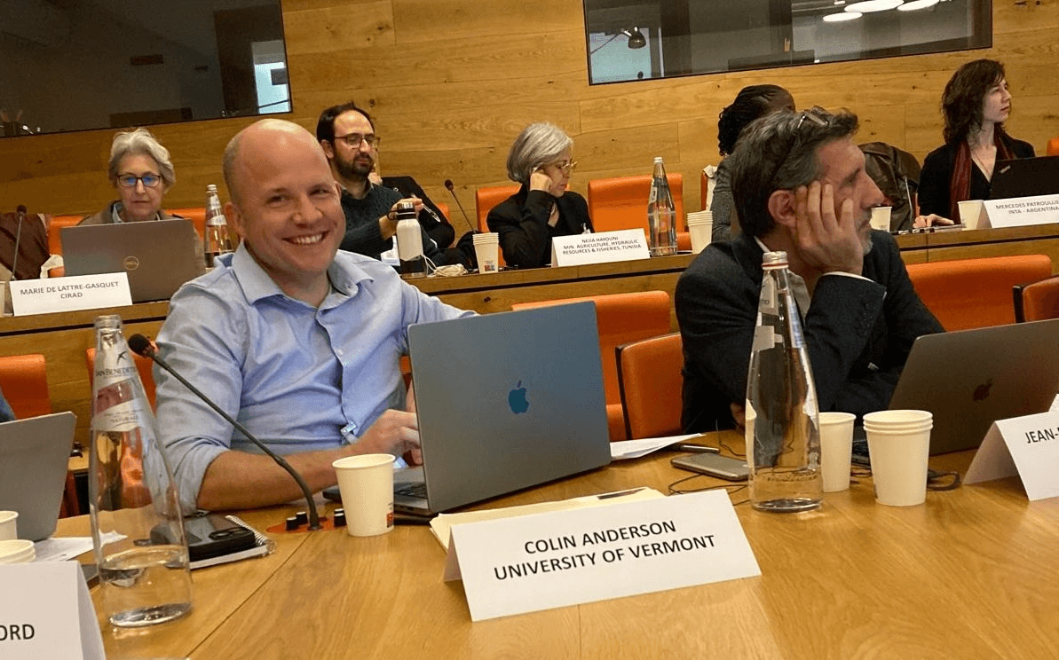 Man in a committee room smiling