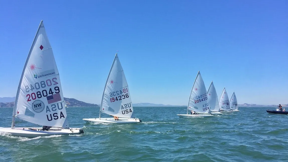 U.S. Sailing Team sailboats lined up in the San Francisco Bay.