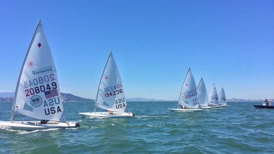 U.S. Sailing Team sailboats lined up in the San Francisco Bay.