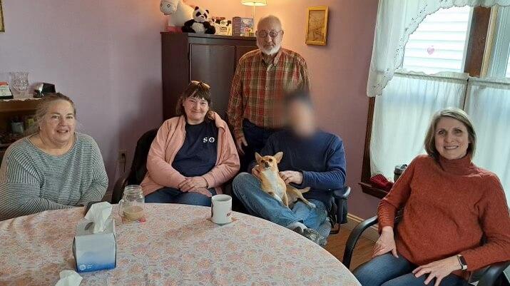 Four individuals sitting at a table