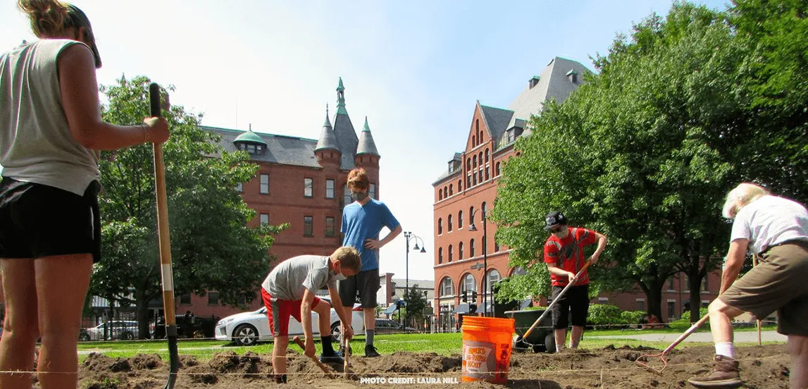Laura Hill and team working in the dirt prepping for sunflower planting