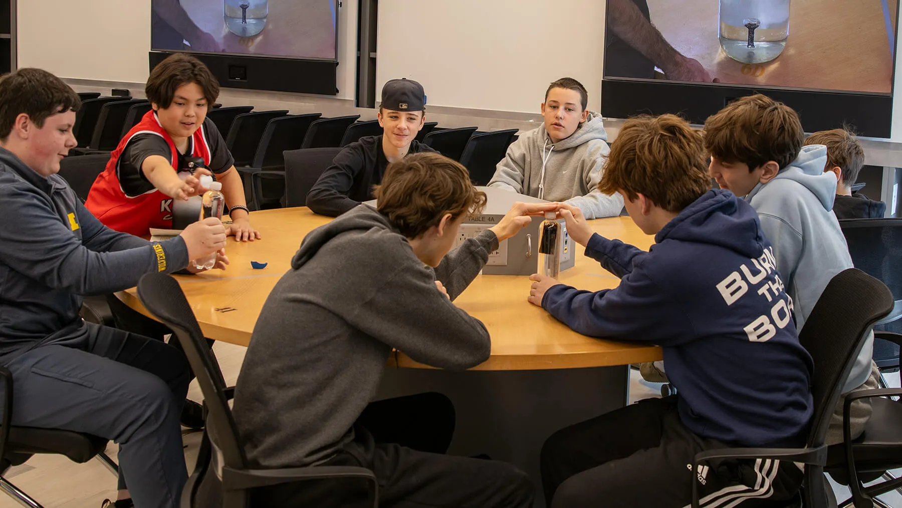 Browns River Middle School students participate in a physics demonstration led by Professor Luke Donforth