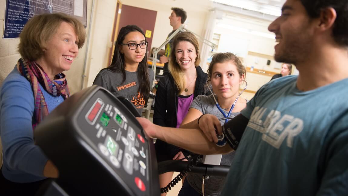 UVM DPT students with faculty in lab
