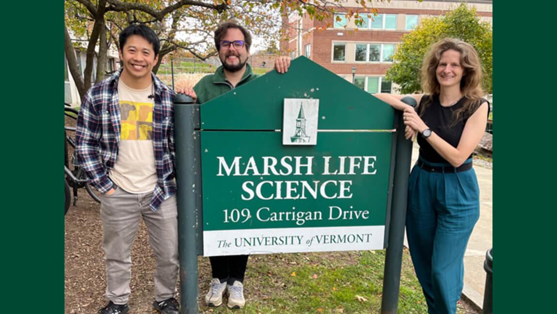 Three new Biology faculty, Dr. Leo Tang, Dr. Joaquin Nunez, and Dr. Elise Lauterbur, standing by the sign outside of Marsh Life Science. 