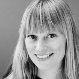 Black and white headshot of Dr. Staples