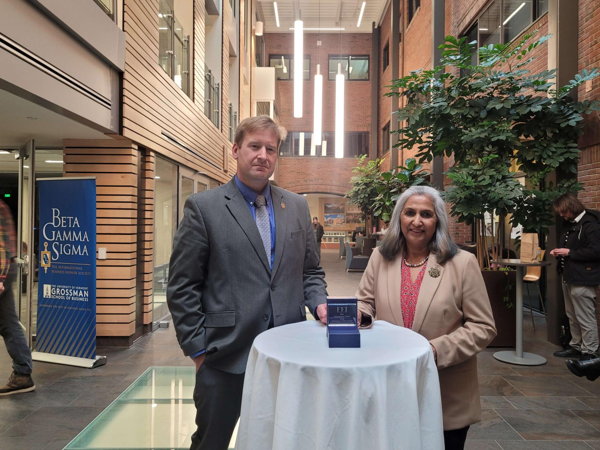 Dita Sharma and Thomas Chittenden pose with the FFI International Achievement Award