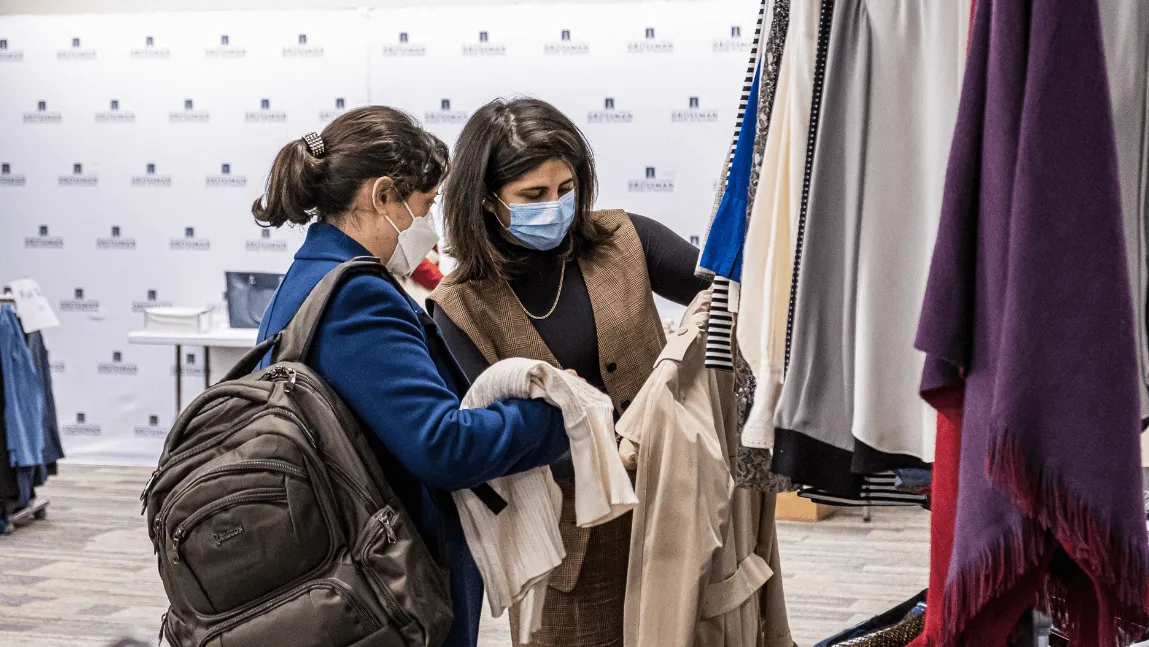 GSAC member Lana Al-Namee helps student find professional clothing