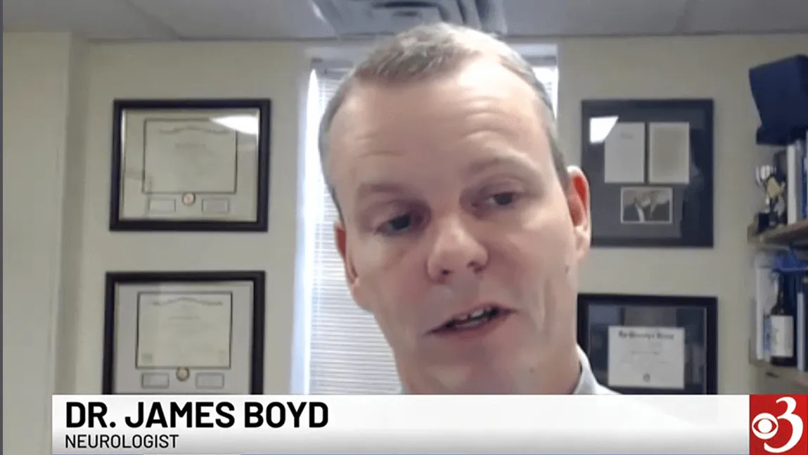 screenshot of UVMMC neurologist James Boyd, M.D., professor of neurological sciences, during a WCAX-TV interview