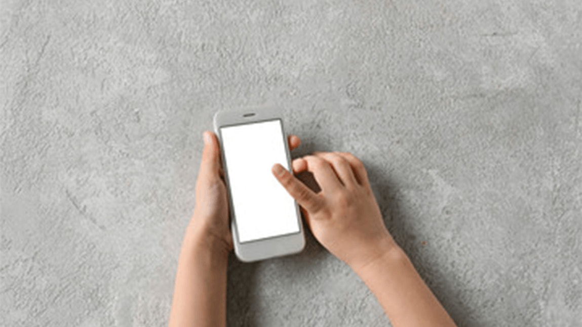 hands of a child holding a cellphone