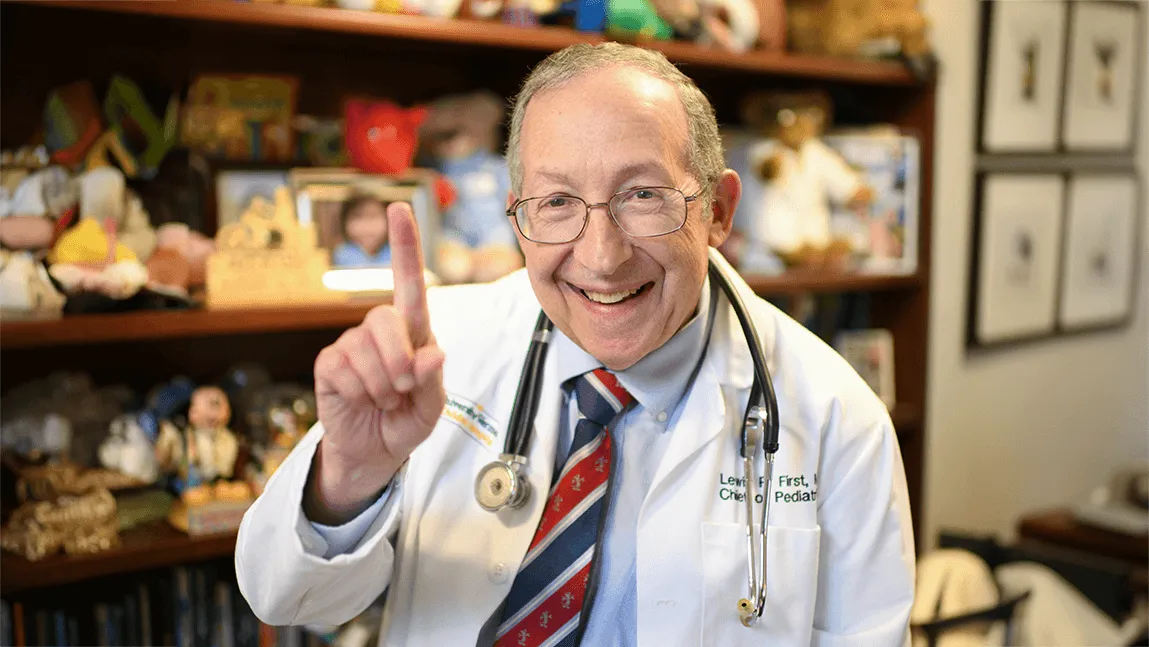 Dr. First holding out his hand in a "#1" sign