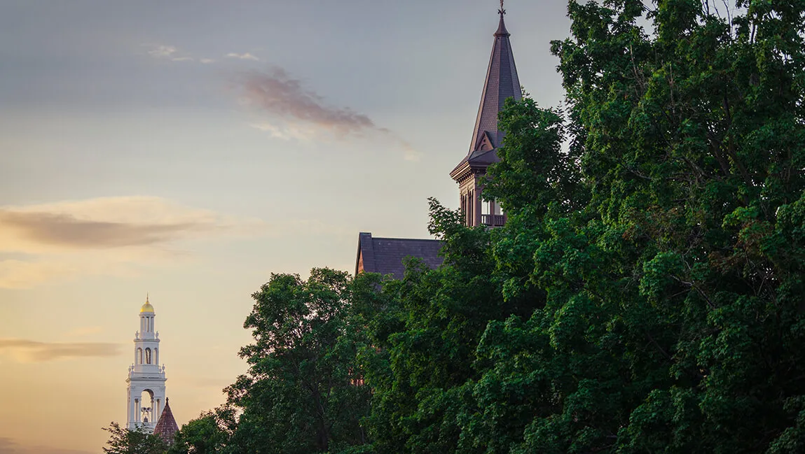 trees and evening sky behind ira allen chapel