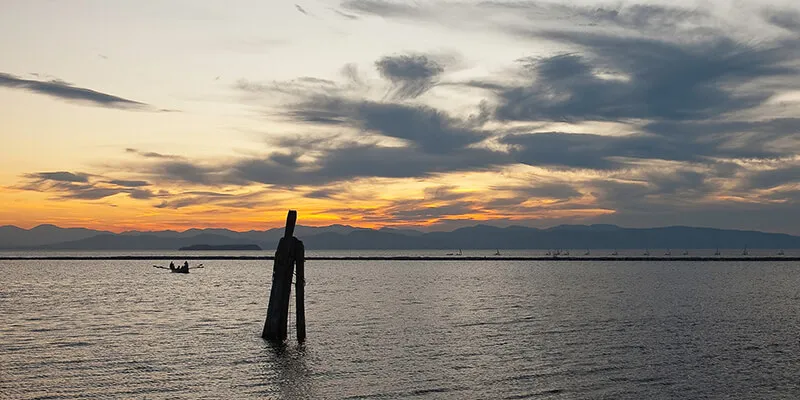 A boat on Lake Champlain at sunset