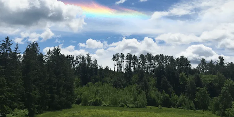 rainbow in the sky over Vermont green landscape