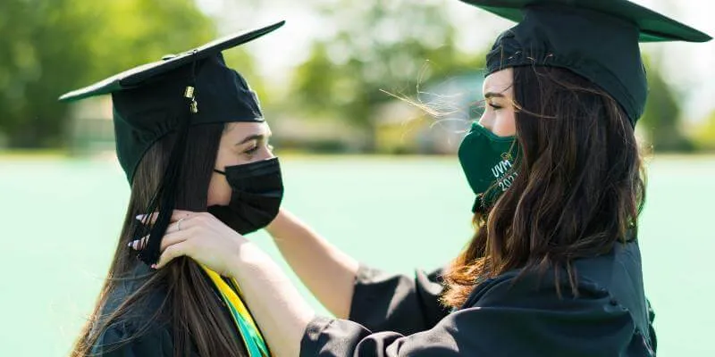Friends congratulate each other on commencement