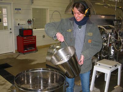 Abby van den Berg pours sap at Proctor Maple Research Center.