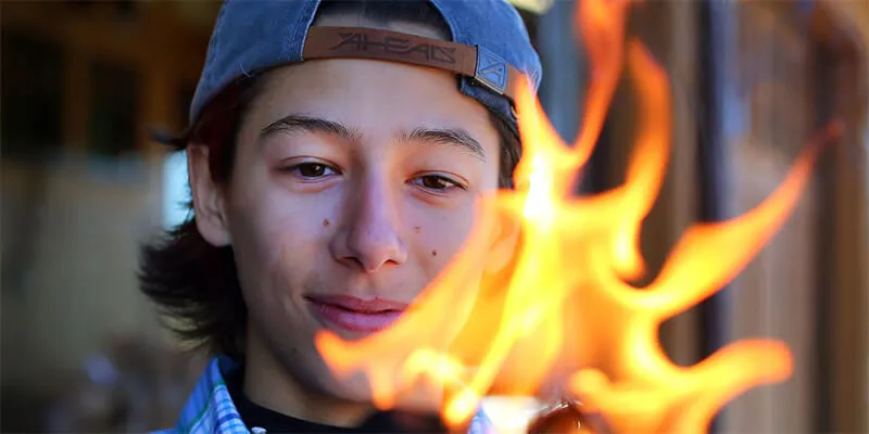 Adam Liszewsk lights fire with his natural fire starter product.