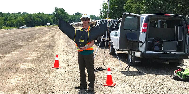 Intern holding drone