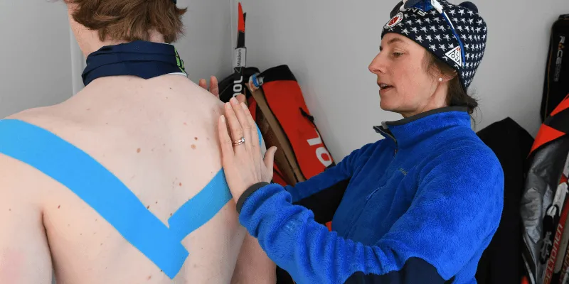 Karen Westervelt assists an athlete