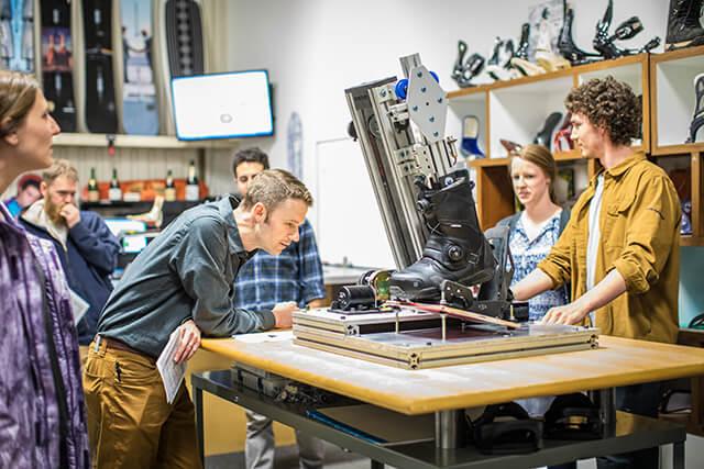Engineering students show their capstone project to the staff at Burton Snowboards