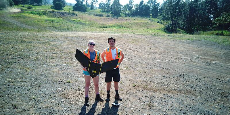 Emma Estabrook and Noah Bell hold drone in Hawaii