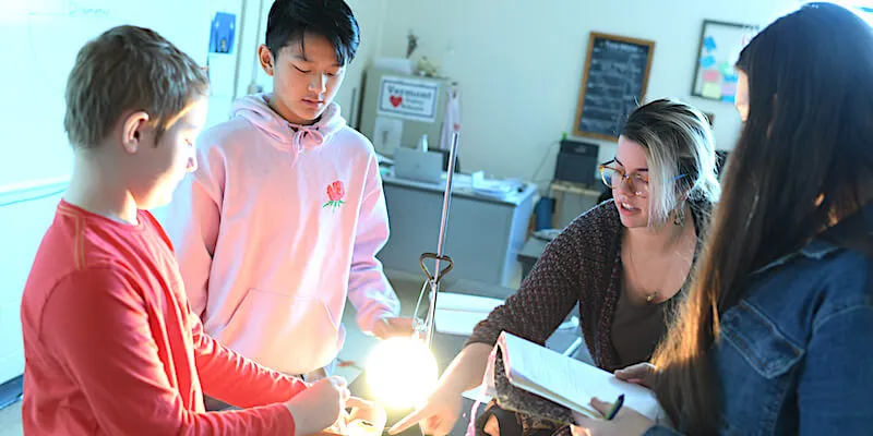 Erica Indiano leading a hands-on activity with students at Hunt Middle School in Burlington.