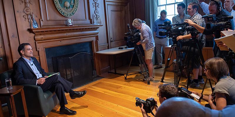 President Garimella speaks with members of the media in his office