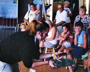 Gwen Lyons educates visitors at ECHO Lake Aquarium and Science Center.