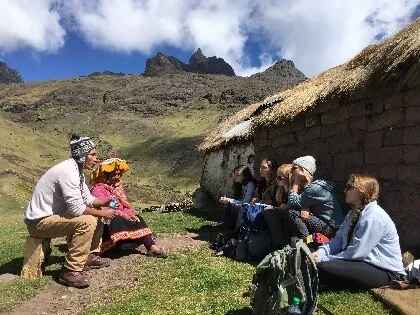 Students from CDAE 171 engaging with community members in Peru
