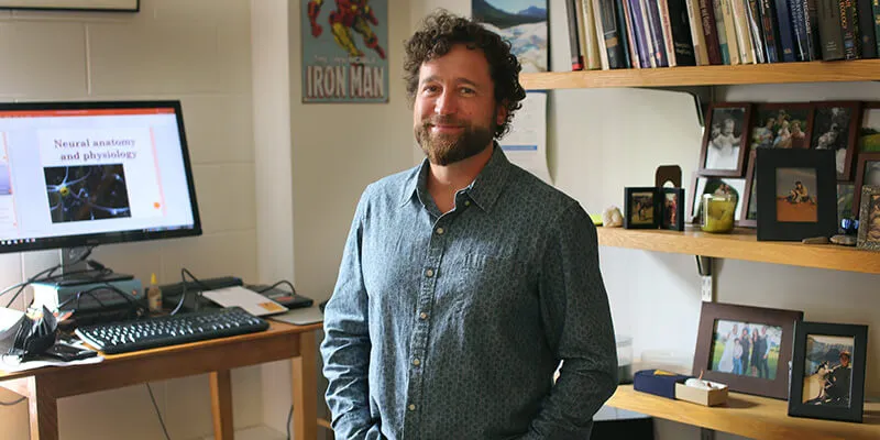 Kirsshenbaum in his office with his computer screen