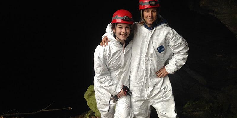 Maddi Sorrentino and Alyssa Bennett at the mouth of a cave