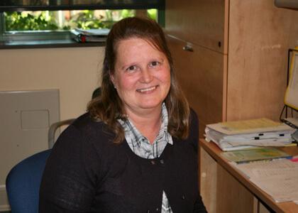 Mary Massey at the front desk in the RSENR Business Service Center