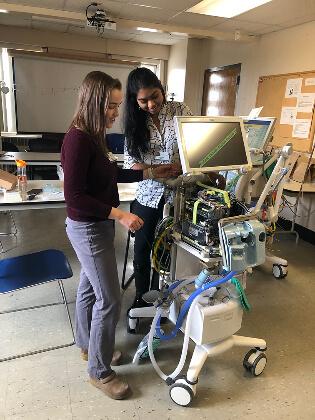Two students repair ventilator