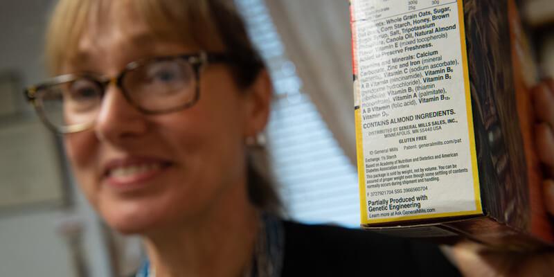 Jane Kolodinsky with GMO labeled food product
