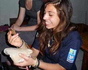 Sam Manetti holds a bat.