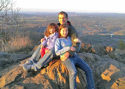 Scott Schwenk and daughters hiking the Holyoke Range in Amherst, MA.