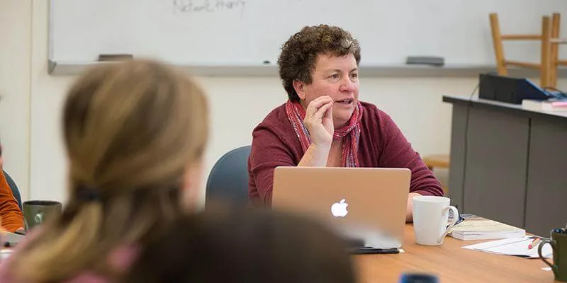 Dr. Amy Trubek teaching a food systems class with students.
