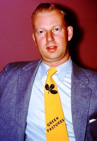 Young red-haired Win Way wearing neck tie that says Green Pastures