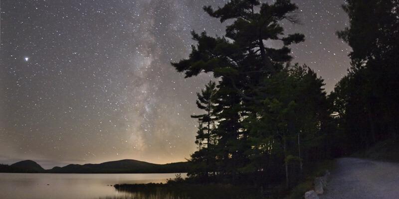 The Milky Way as seen from carriage road along Eagle Lake at Acadia National Park.