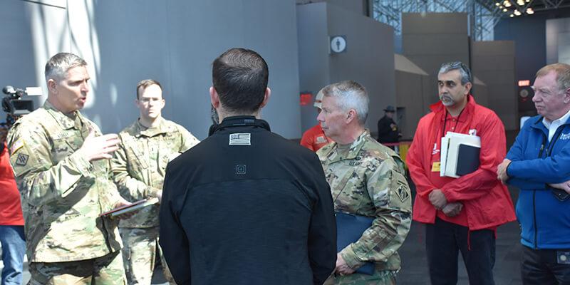 army corps engineers standing in Javits Center talking