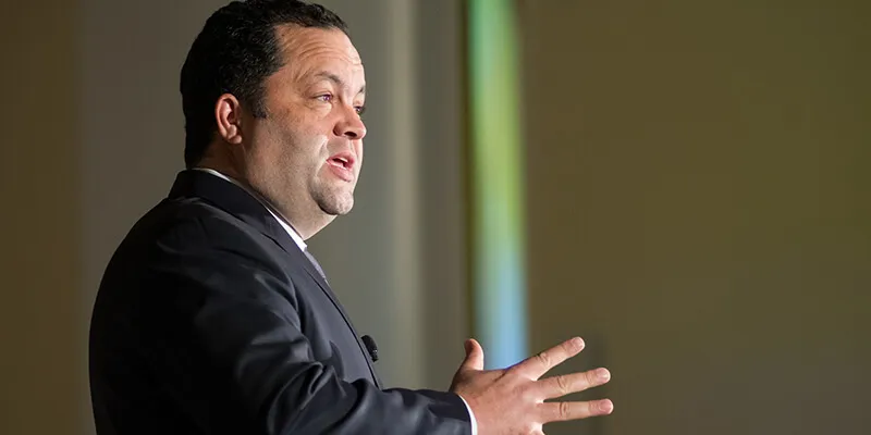 Ben Jealous speaks on stage at the University of Vermont