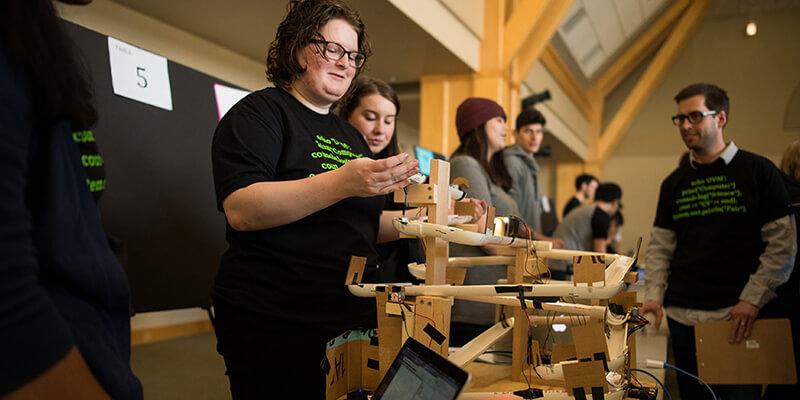 Students demonstrate their project at the Computer Science Fair.