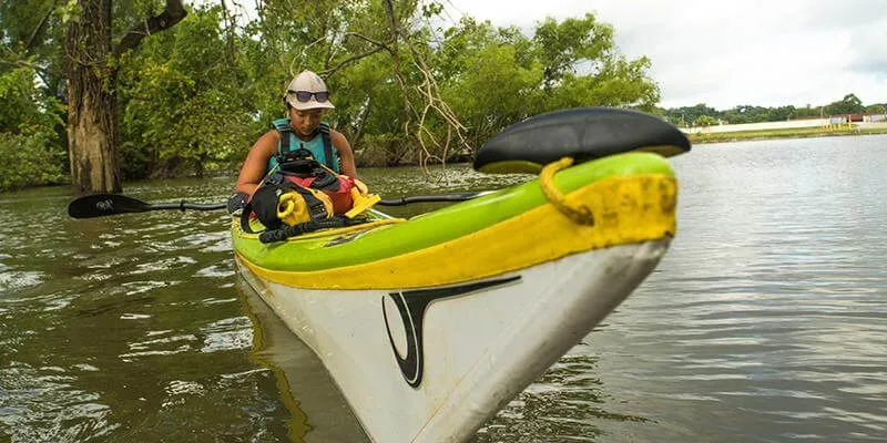 Maya Dizack paddles on the Mississippi River