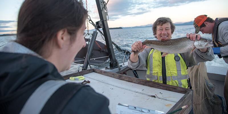 Ellen Marsden holding a trout on the Melosira