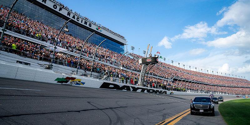 Presidential limo leads race cars around lap of the track at Daytona 500, 2020.