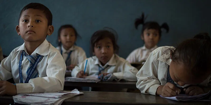 Elementary-aged students in a classroom in Nepal