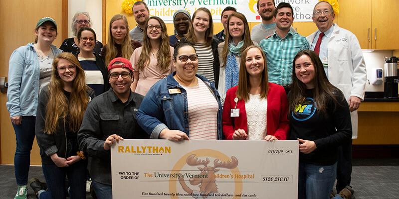 Students present a fundraising check to UVM Children's Hospital staff